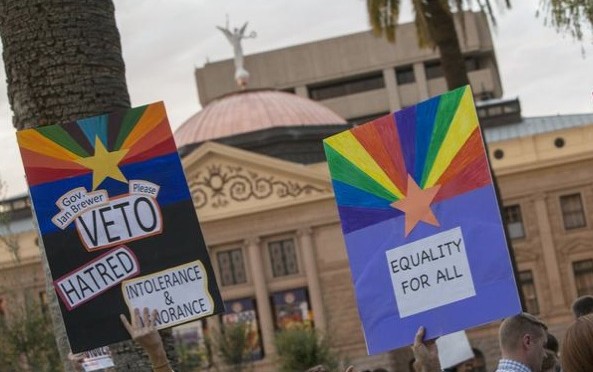 Arizona governor vetoes antigay law under threat of another boycott