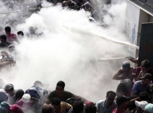 Kos immigrants being sprayed August 12 2015