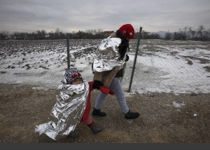 Refugees in thermal blankets ( Boris Grdanoski:AP) Jan 24 2016