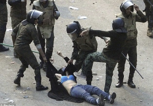 Women beaten in Tahrir Square (Reuters) Dec 7 2016