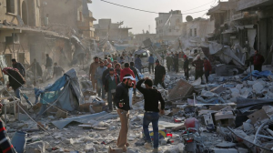 Residents in the northern Syrian Atareb look for survivors after an air raid. © Zein Al Rifai : AFP : Getty Images