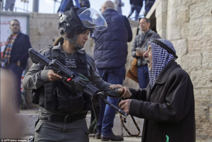 Pal old man and woman soldier at Al Aqsa Dec 8 2017 (AFP:Getty Images)