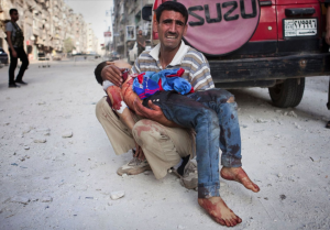 Syrian father in Aleppo with son killed by Syrian bombers in October 2012